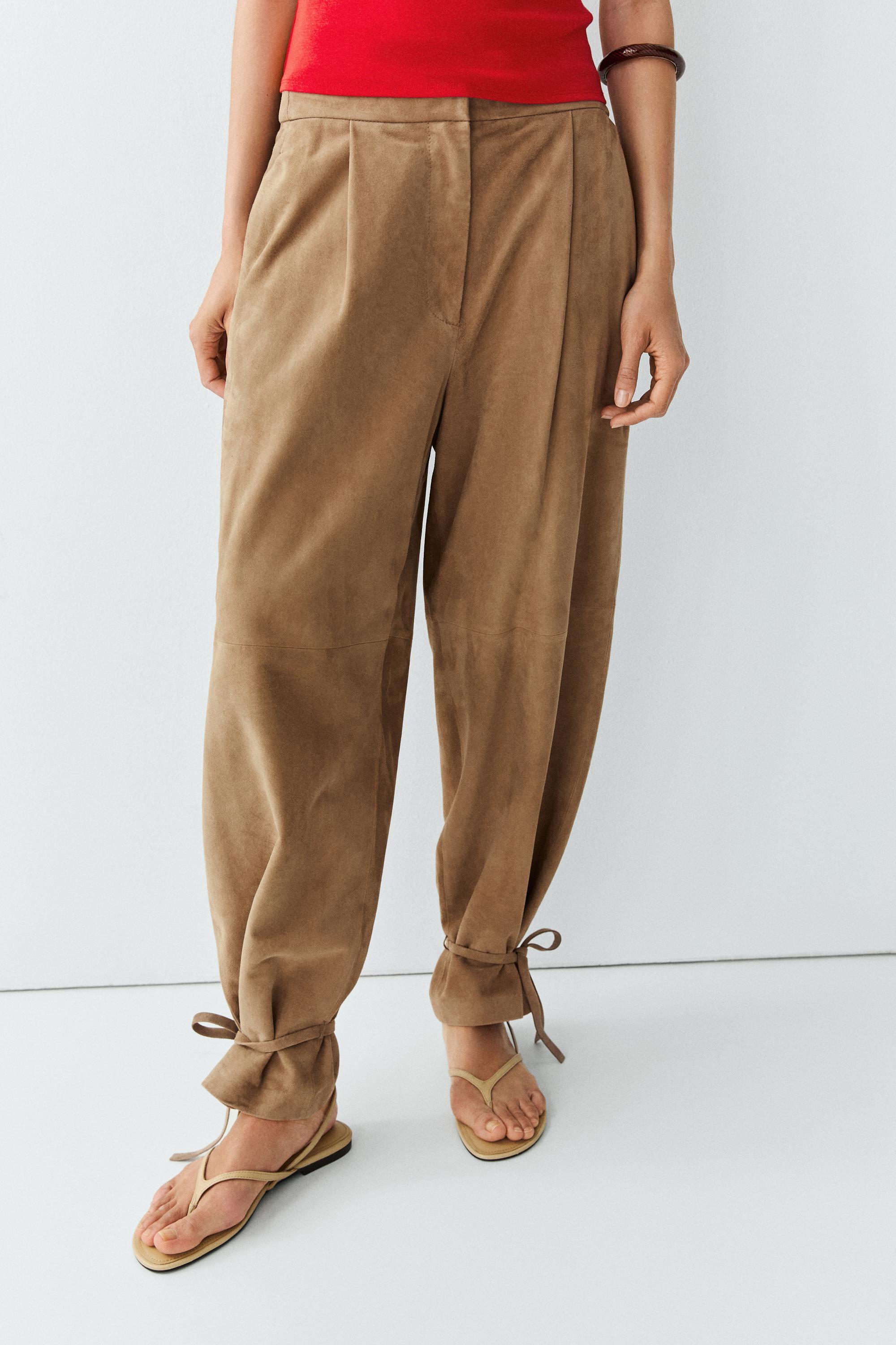 Suede leather pants with tie-detail hems